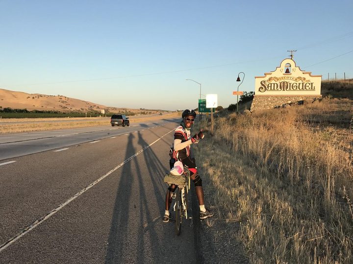 At the San Miguel town sign on Highway 101 at sunset